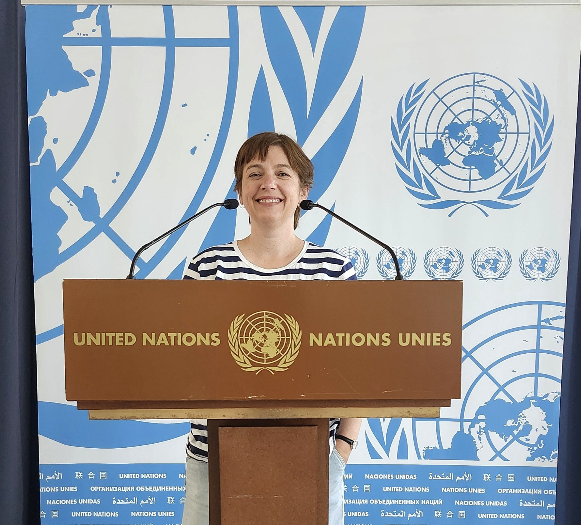 Adina Gray at the United Nations podium in Geneva